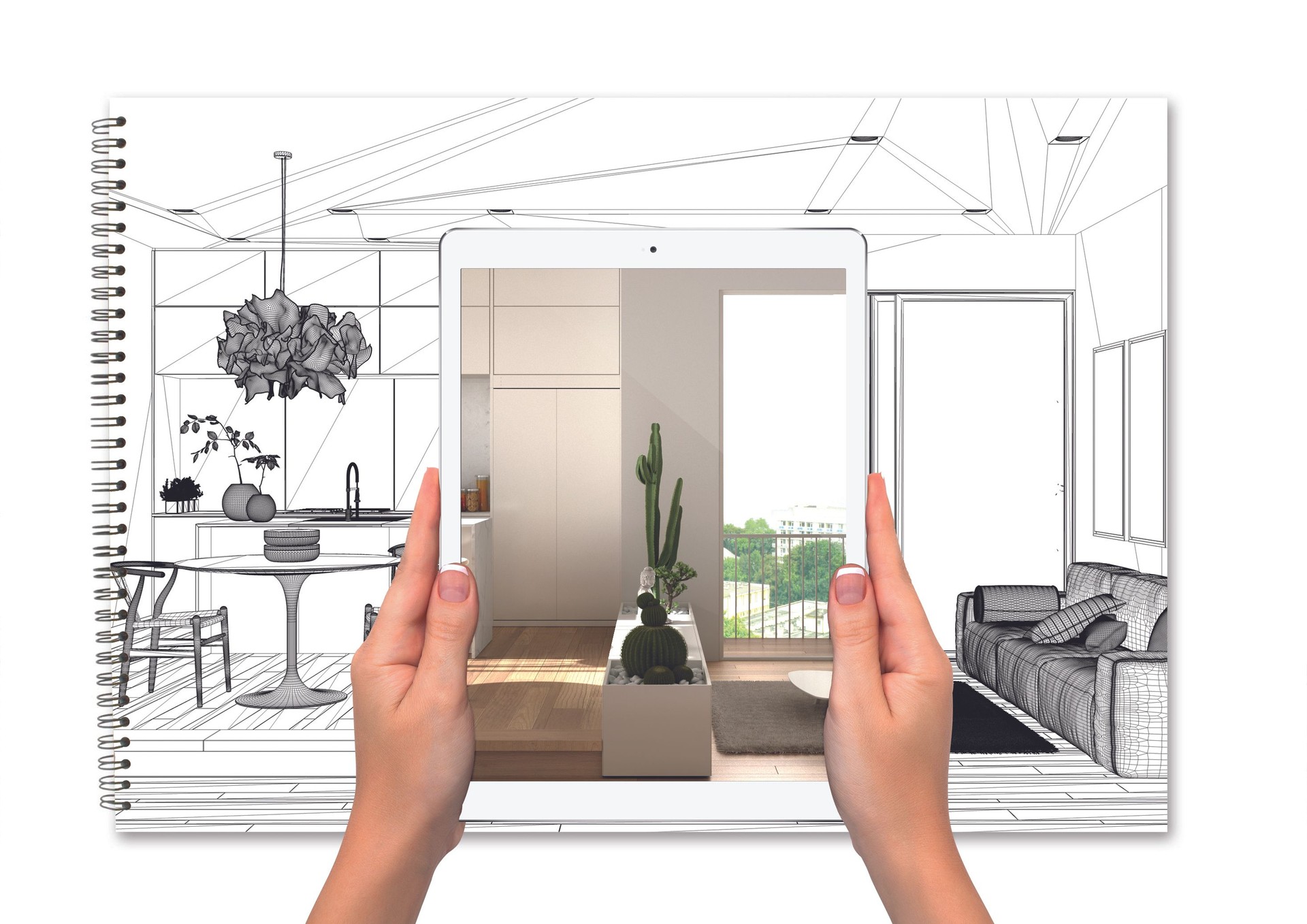 Hands holding tablet showing kitchen, notebook with blueprint sketch in the background, augmented reality concept, application to simulate furniture and interior design products